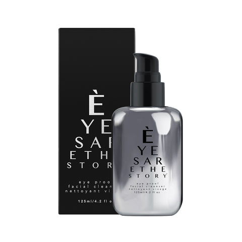 A gray pump bottle, labeled Eyes are the Story, Eye Proof Facial Cleanser, is infused with resveratrol and sits next to a matching black box. This 125 ml (4.2 fl oz) cleansing gel from Eyes are the Story is rich in antioxidants for rejuvenating care.