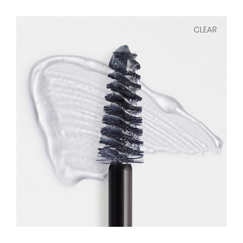 A clear mascara wand from RevitaLash Hi-Def Brow Gel is shown with black bristles on a white background, ideal for precision styling and flawless eyebrow setting. The word CLEAR appears in the top right corner.