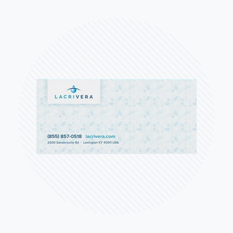 A business card with a light blue triangle pattern displays the Lacrivera brand, featuring contact info: phone (855) 857-0518, website lacrivera.com, and address 2500 Sandersville Rd, Lexington KY 40511 USA—your partner in innovative dry eye solutions like VeraC7 Collagen Plugs.