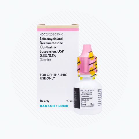 A white and pink box labeled Tobramycin and Dexamethasone Ophthalmic Suspension 0.3%/0.1% stands beside a small bottle with a pink cap. Manufactured by Bausch & Lomb, it is designated for ophthalmic use only, specifically for bacterial eye infections, in a 10mL size.