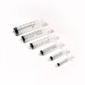 A diagonal set of six transparent MedPharma USA syringes features a 5cc Luer Lock syringe from the Excel 100/Box set. Each syringe, with black measurement markings and white plungers, is perfect for precise medication administration against a white background.