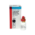 A small white bottle of Tropicamide 1% Ophthalmic Solution, Bausch + Lomb, with a red and yellow cap for eye use sits next to its box sporting blue and red designs. The packaging highlights the MedPharma USA brand.