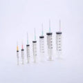 A row of seven 1cc Henke-Ject syringes, made of medical-grade plastic with luer lock mechanisms by MedPharma USA, is arranged from smallest to largest on a plain white background.