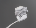 A close-up of a sleek, modern white device with a curved, modular design on a gray background. It features a clip or hinge mechanism and cord, resembling the Lipiflow Cable Replacement (REF-240100) by Johnson and Johnson, suggesting electronic or medical use.