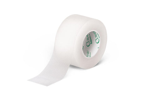 A roll of Transpore medical tape by MedPharma USA, excellent for wound care, is unspooled to show its textured surface with a CURAD branded green inner core. It rests against a white background.